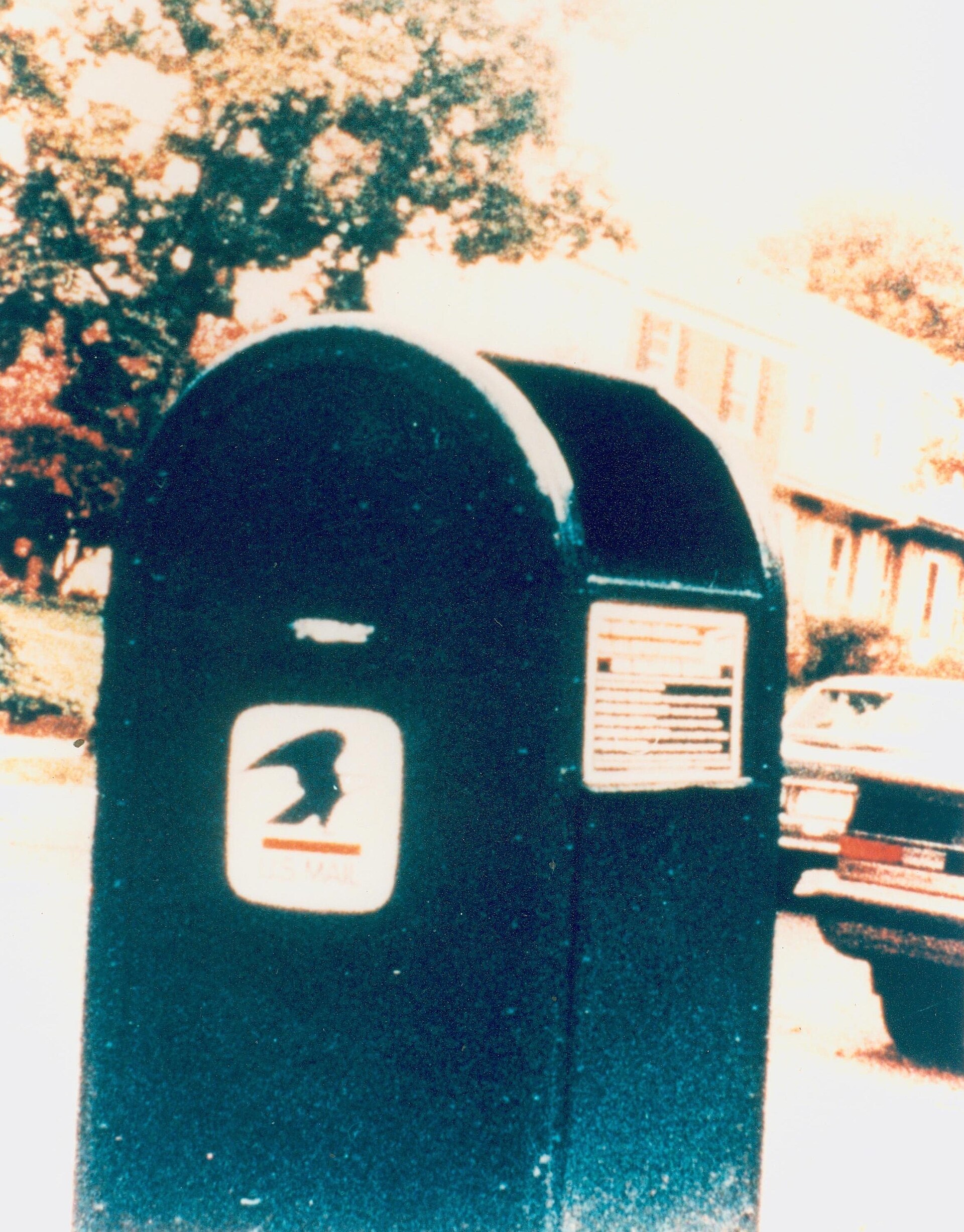 USPS mail collection box used to communicate meeting requests between Soviet intelligence handlers and U.S. Government employee Aldrich Ames. This FBI photo shows the chalk mark used to indicate that 