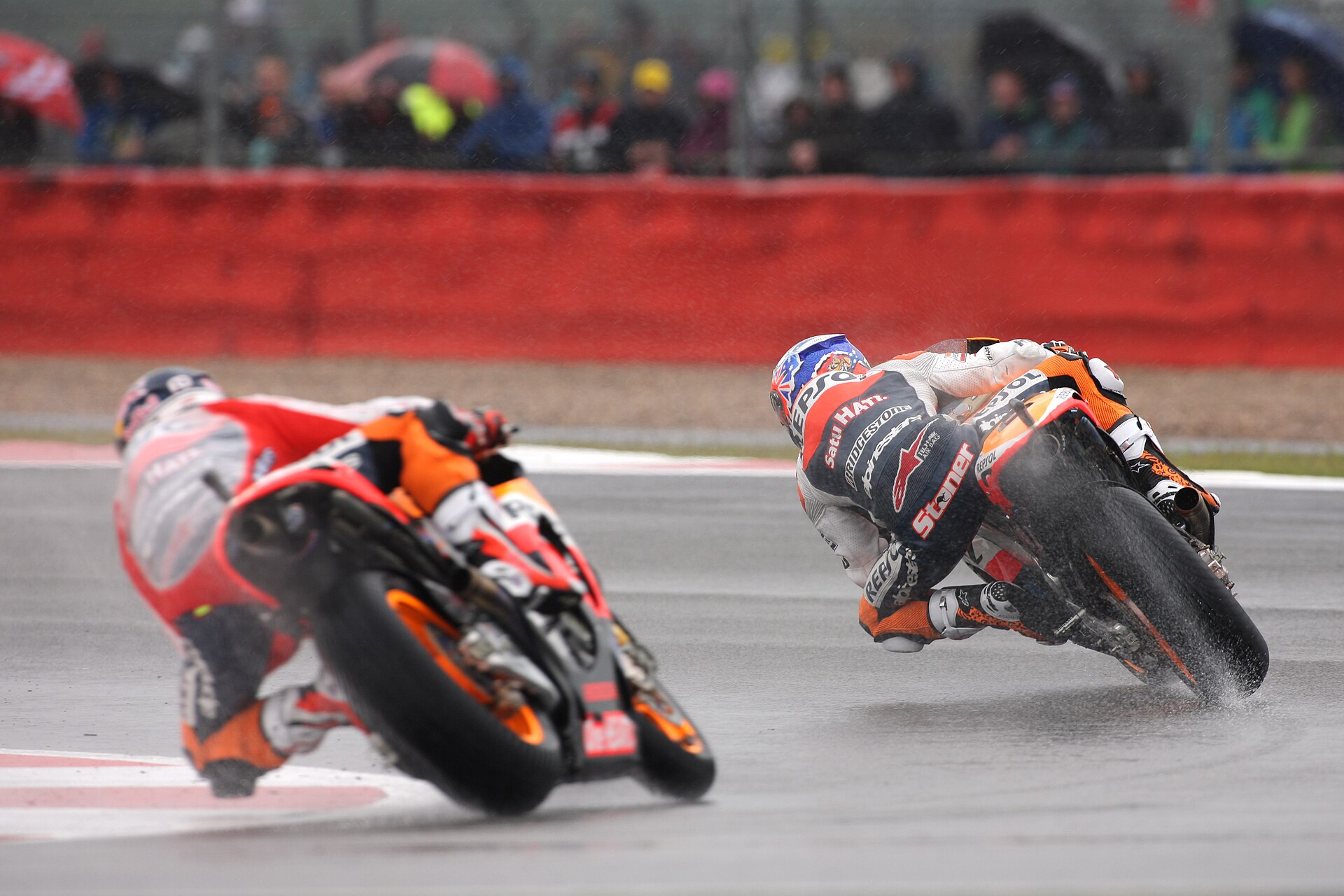 Casey Stoner and Andrea Dovizioso, riding their Repsol Honda's at the 2011 British Grand Prix.