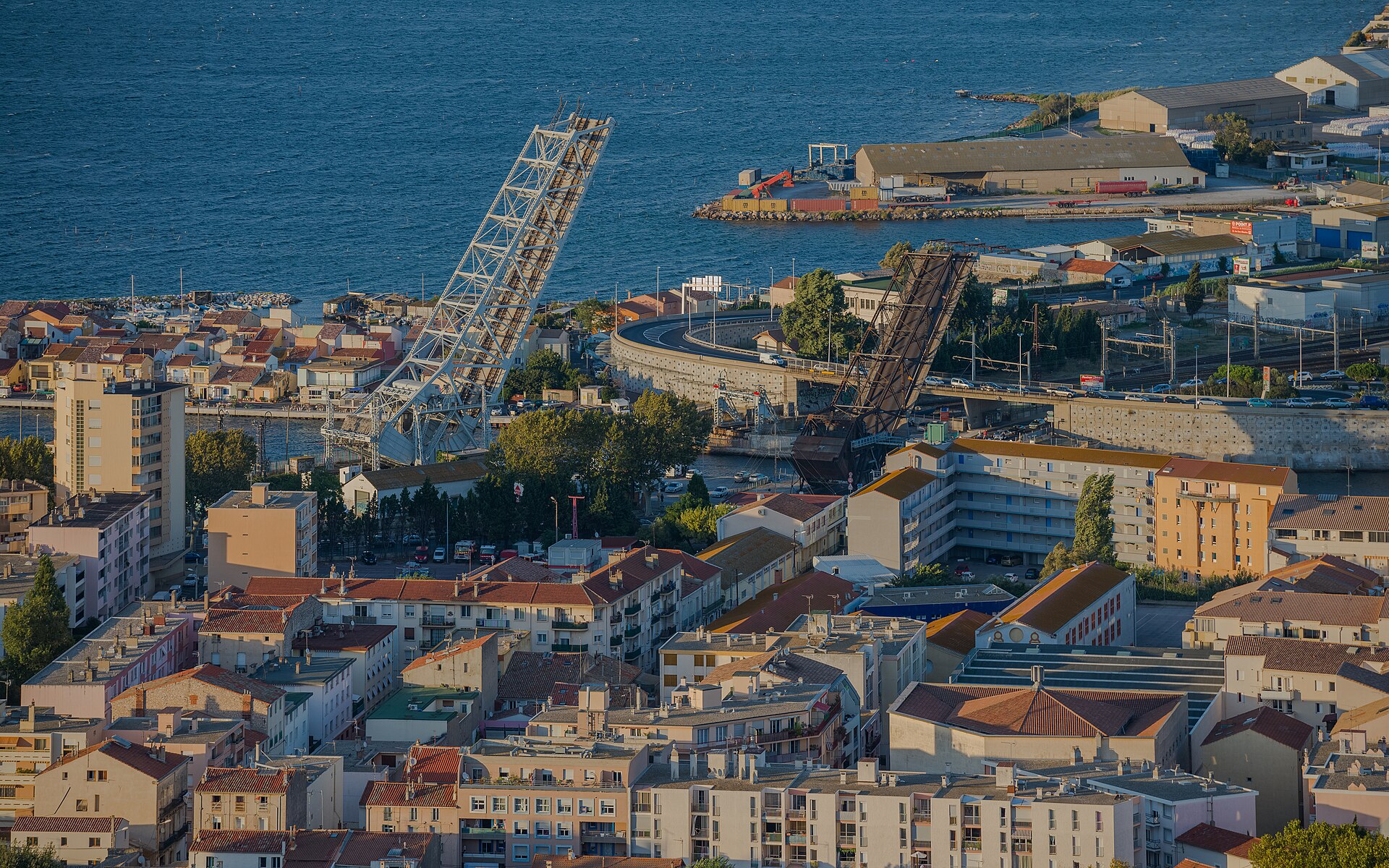 Maréchal Foch Bridge (1932), at left, and Sadi-Carnot Bridge (1949), at right, the both are bascule bridges and in open position. The both built by the Établissements Daydé. Sète, Hérault, France.